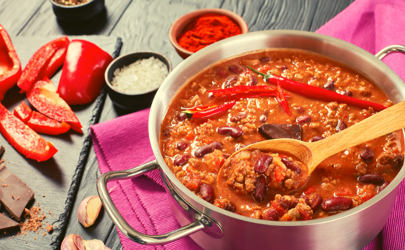 chili pot, wooden spoon, and ingredients